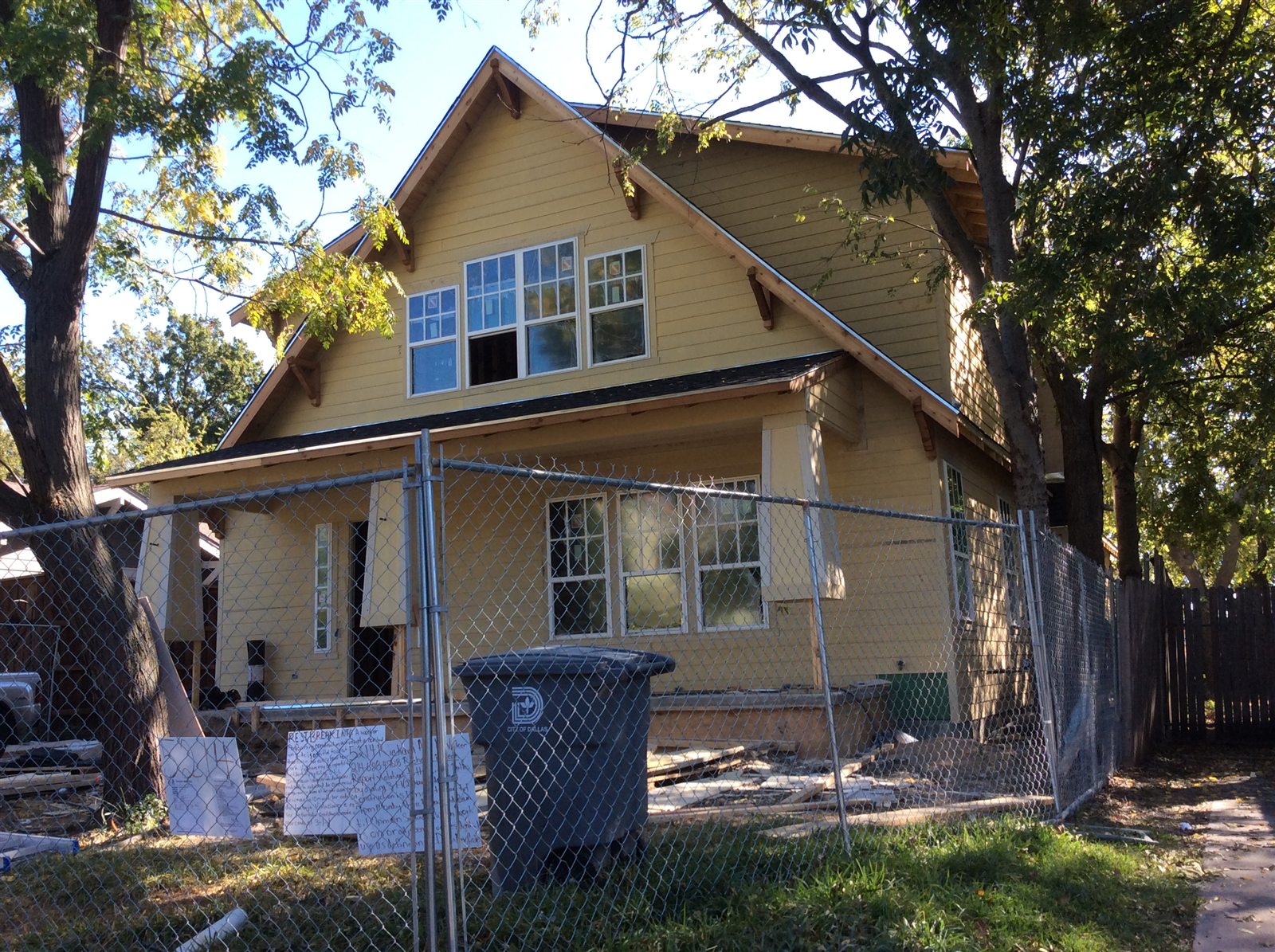 Craftsman-style home exterior during construction with siding and windows installed