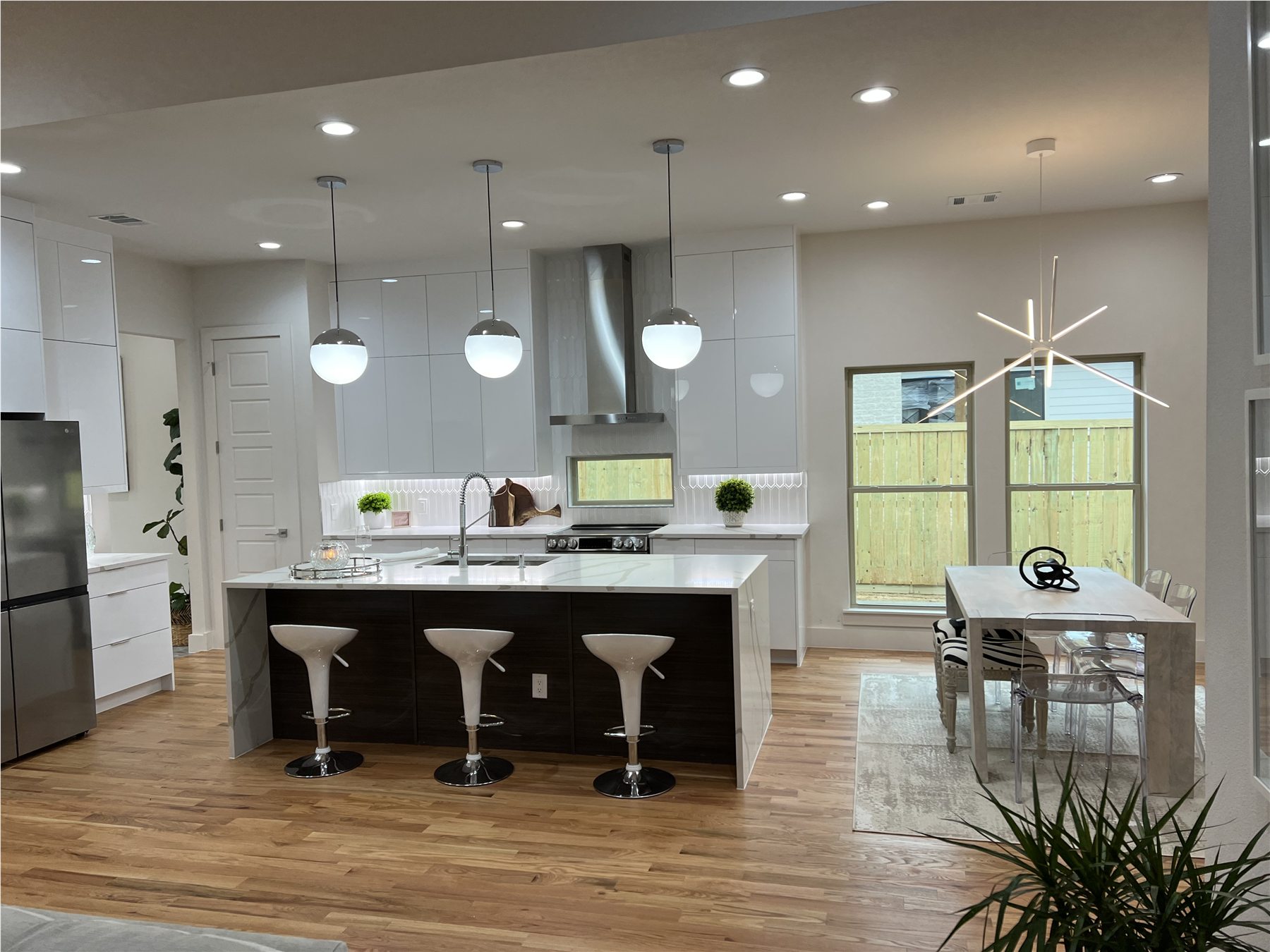 Bright modern kitchen with island and pendant lights