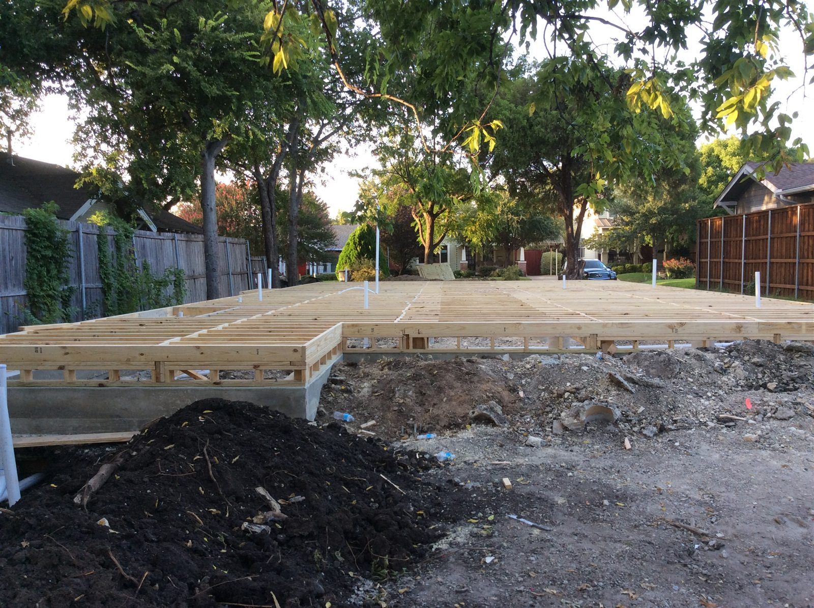 Wide view of pier-and-beam floor framing across the building footprint